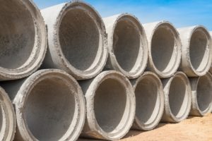 Concrete drainage pipes for industrial building construction.